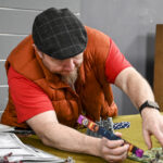 Dave Brown plays the game “Warhammer 40,000” at Four Horseman in the Morgantown Mall on Saturday.